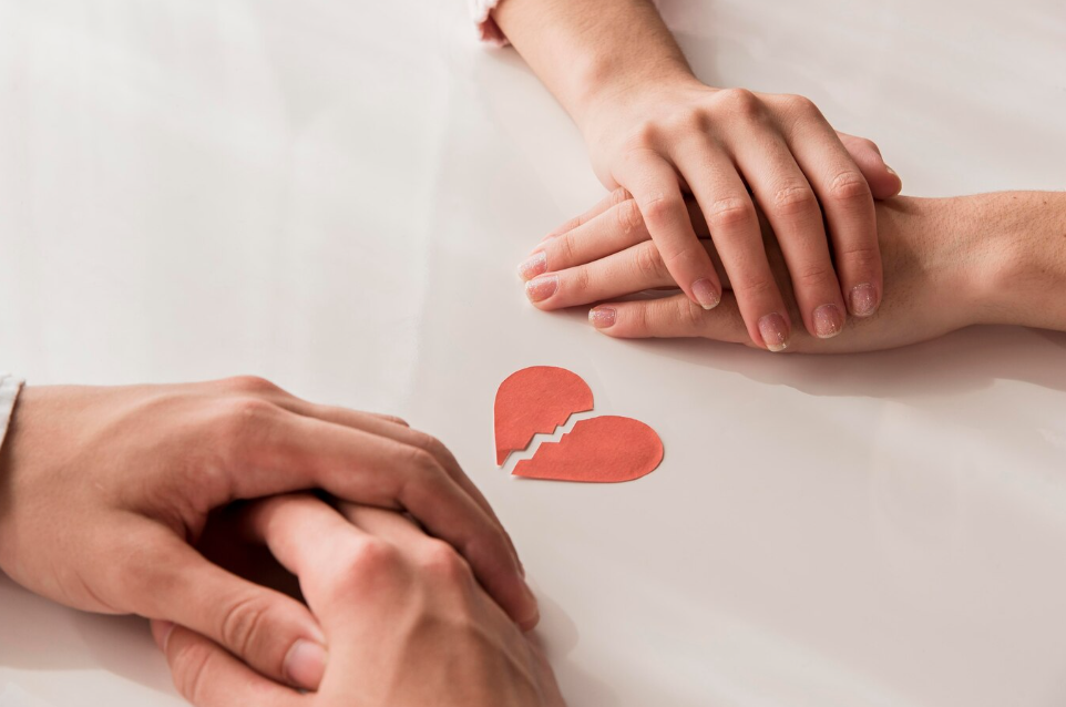 AFL - close-up hands with broken heart