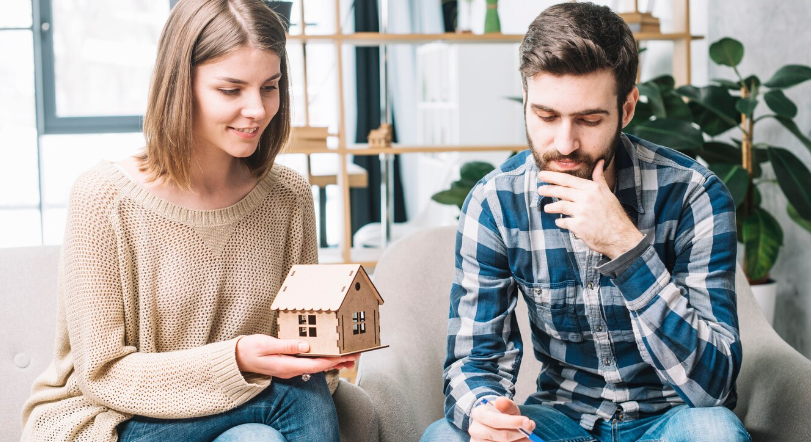 couple thinking about properties and investments