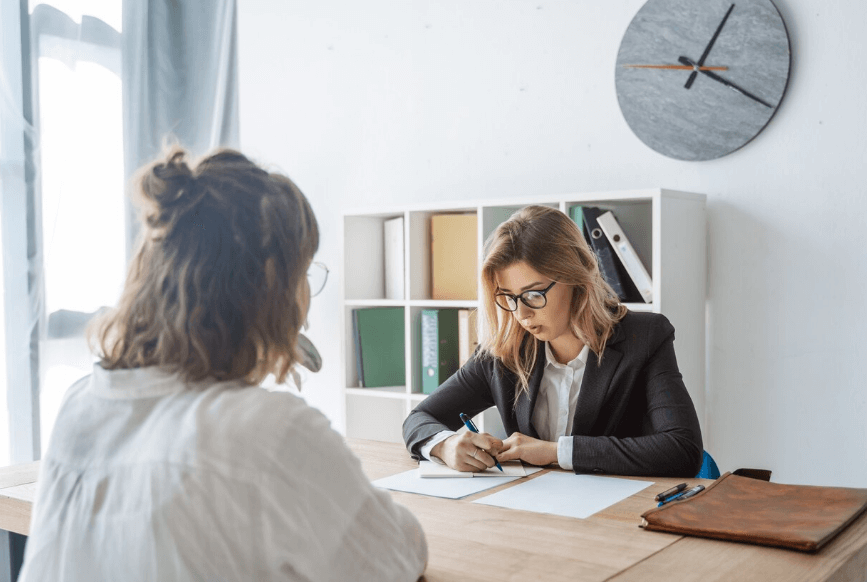a woman talking to a lawyer for a full child custody